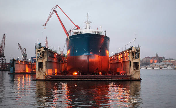 View of the bow of a large commercial freight ship in floating dry dock on the water in Gothenburg, Sweden.  Depth of field with focal point on centre.  High Iso.